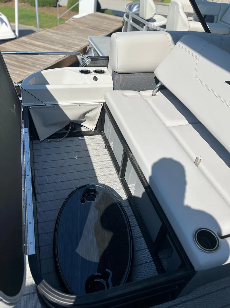 Slide: The Image of 2024 Starcraft SLS 3 Q DH boat interior with seating and table. - 8