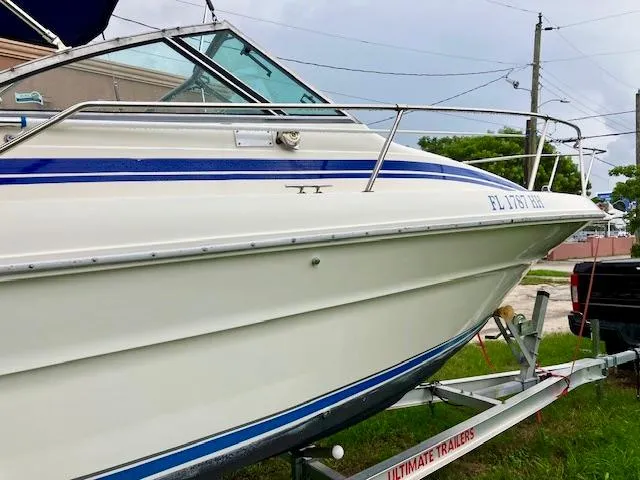 Slide: The Image of 1990 Sea Ray 240 Sundeck boat on a trailer, side view. - 11
