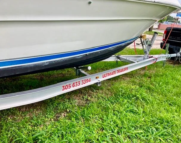 Slide: The Image of Sea Ray 240 Sundeck 1990 on Ultimate Trailers boat trailer, contact 305-633-3394. - 12