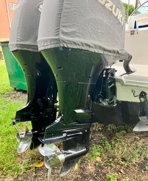 Slide: The Image of Twin Suzuki outboard motors on a 1990 Sea Ray 240 Sundeck boat. - 5