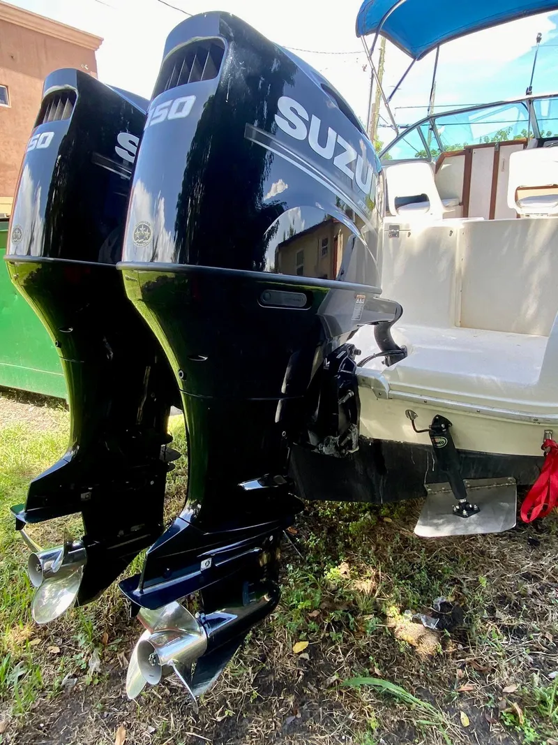 Slide: The Image of Twin Suzuki outboard motors on a 1990 Sea Ray 240 Sundeck boat. - 6
