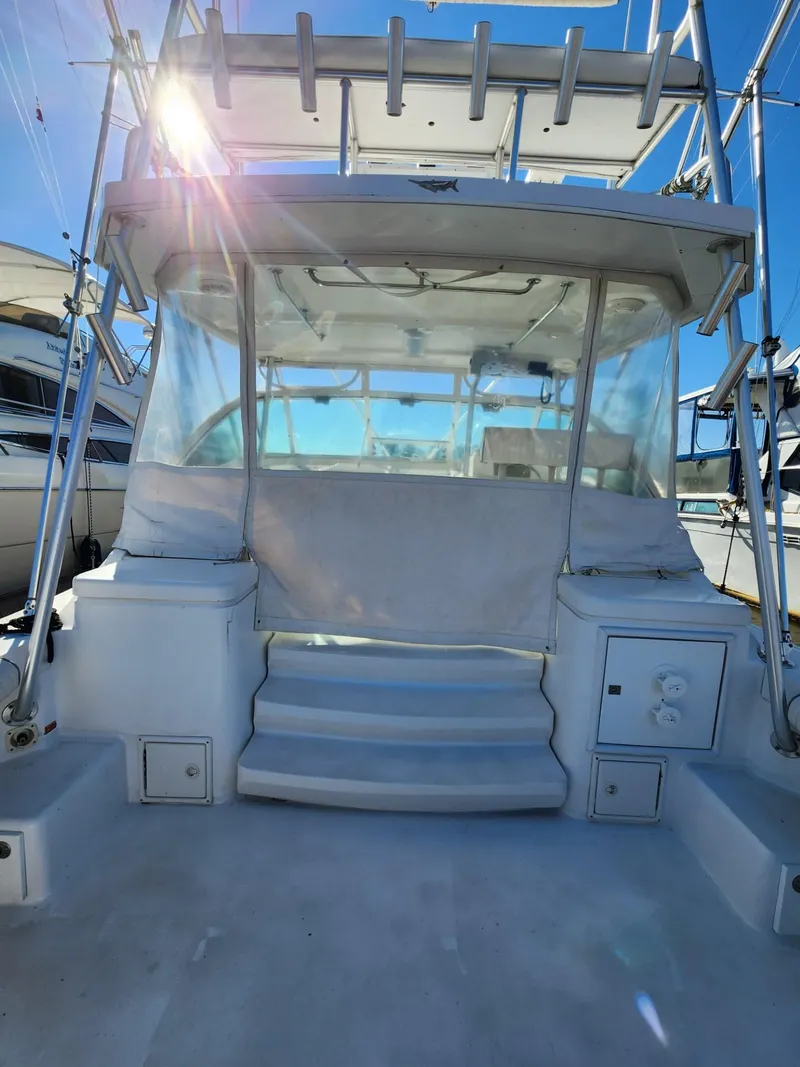 Slide: The Image of 2004 Luhrs 36 Open boat with covered cockpit and steps leading to the helm. - 11