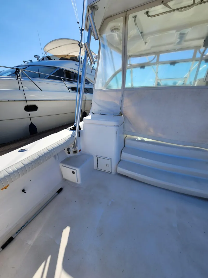 Slide: The Image of 2004 Luhrs 36 Open boat deck with seating and storage. - 13