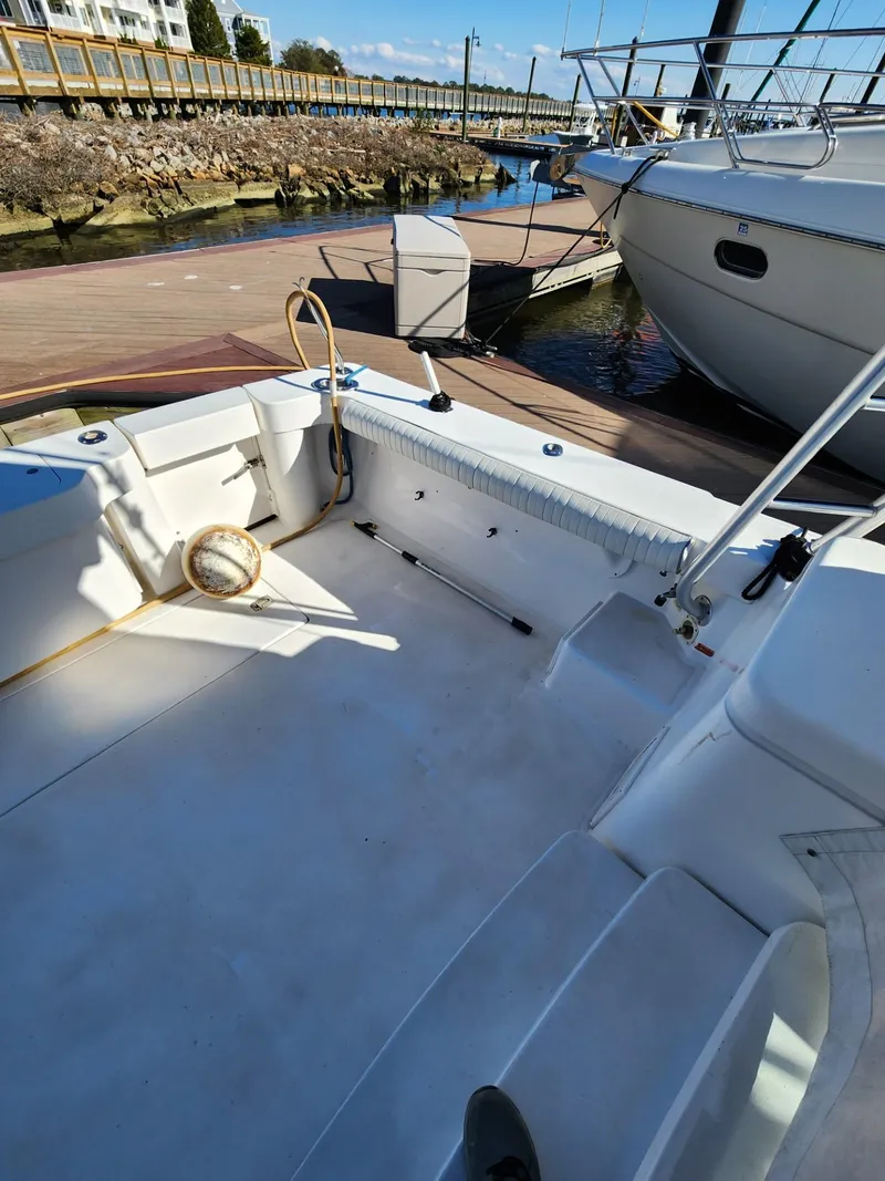 Slide: The Image of 2004 Luhrs 36 Open boat docked, spacious deck area. - 14