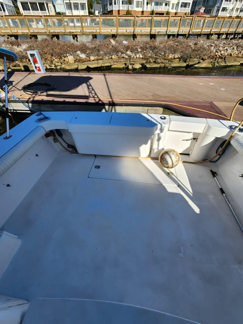 Slide: The Image of 2004 Luhrs 36 Open boat deck with seating and storage compartments. - 15