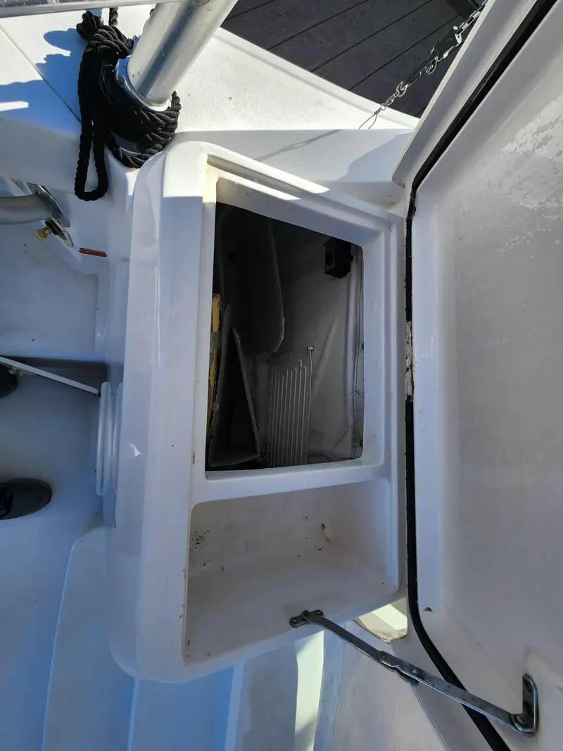 Slide: The Image of Open storage compartment on a 2004 Luhrs 36 Open boat. - 21