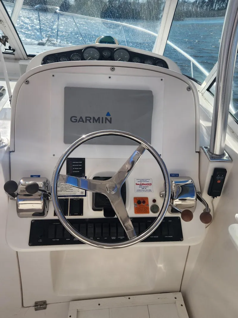 Slide: The Image of 2004 Luhrs 36 Open boat helm with Garmin navigation system. - 23