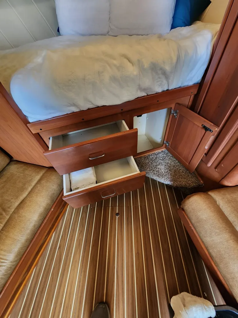 Slide: The Image of 2004 Luhrs 36 Open cabin with open drawers and storage compartments. - 40