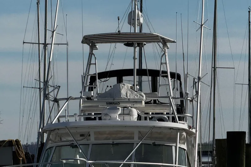 Slide: The Image of 2004 Luhrs 36 Open yacht kitchen with stove and sink. - 58