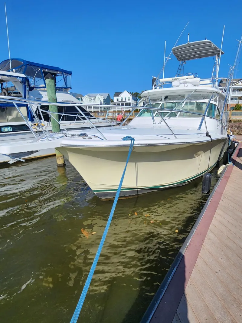 Slide: The Image of 2004 Luhrs 36 Open boat docked at a marina. - 6
