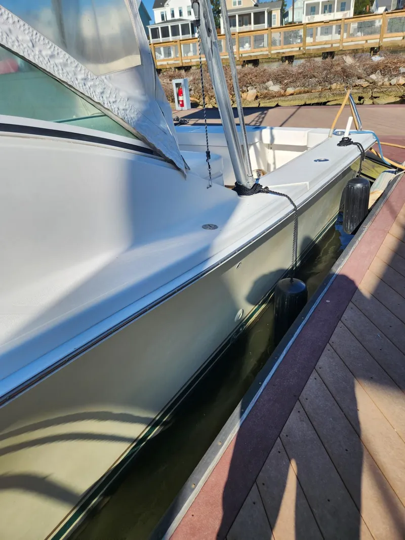 Slide: The Image of 2004 Luhrs 36 Open boat docked at a marina. - 8