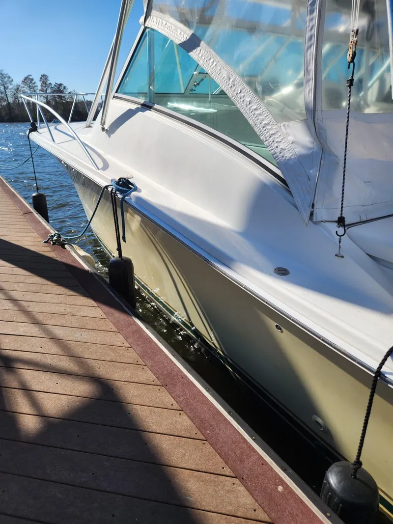Slide: The Image of 2004 Luhrs 36 Open boat docked at a marina. - 9