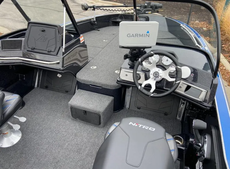 Slide: The Image of 2024 Nitro ZV20 boat interior with Garmin navigation system and modern steering wheel. - 6