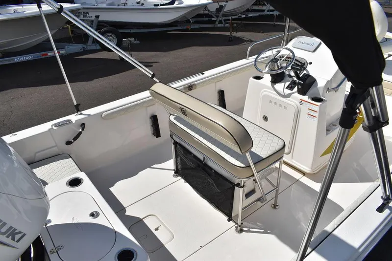 Slide: The Image of 2021 Carolina Skiff 19 LS boat interior with steering console and seating. - 13