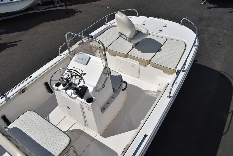 Slide: The Image of 2021 Carolina Skiff 19 LS boat interior with seating and steering console. - 16