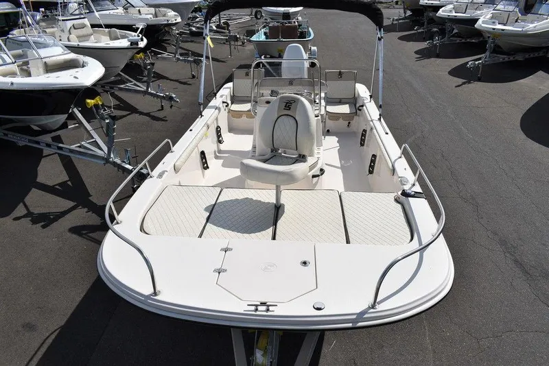 Slide: The Image of 2021 Carolina Skiff 19 LS boat on display at a dealership. - 19