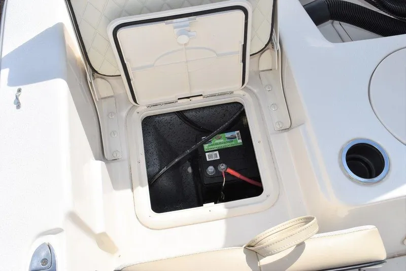 Slide: The Image of 2021 Carolina Skiff 19 LS boat battery compartment with open hatch. - 26
