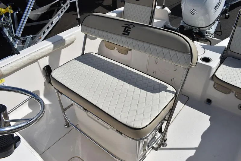 Slide: The Image of 2021 Carolina Skiff 19 LS boat interior with cushioned seating and steering wheel. - 29