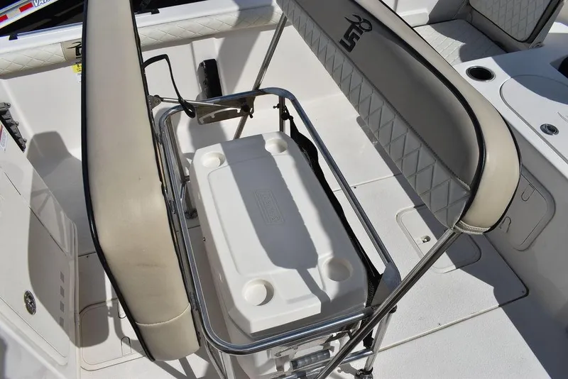 Slide: The Image of 2021 Carolina Skiff 19 LS boat interior with cooler and seating. - 30