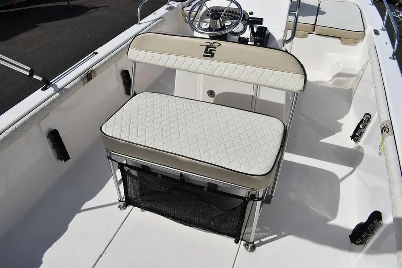 Slide: The Image of 2021 Carolina Skiff 19 LS boat interior with cushioned seating and steering console. - 32