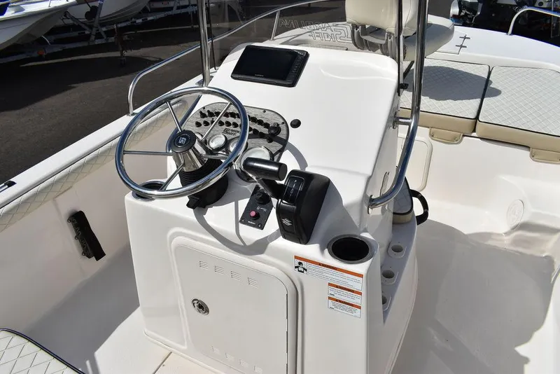 Slide: The Image of 2021 Carolina Skiff 19 LS boat console with steering wheel and controls. - 35