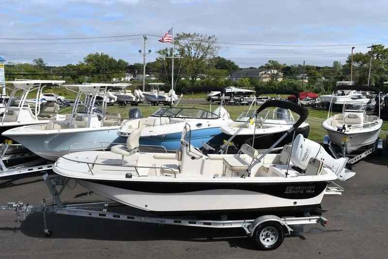 Slide: The Image of 2021 Carolina Skiff 19 LS boat on trailer in marina lot. - 4