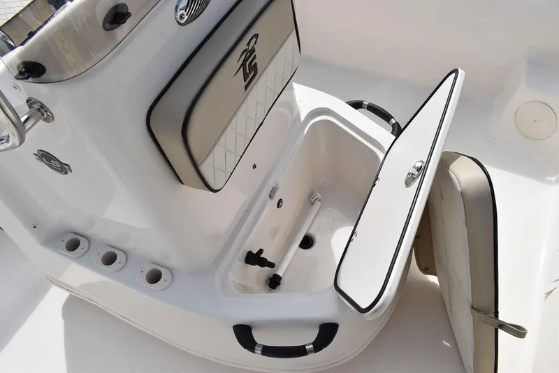 Slide: The Image of 2021 Carolina Skiff 19 LS boat interior with open storage compartment. - 40