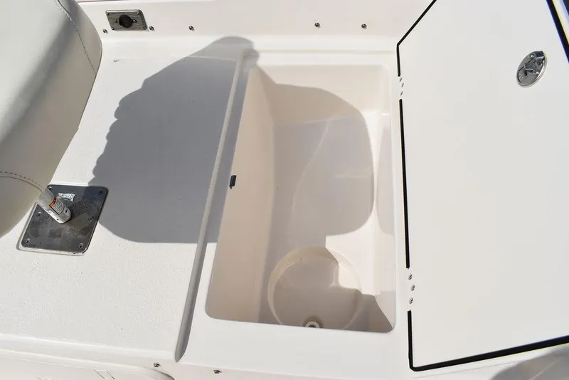 Slide: The Image of 2021 Carolina Skiff 19 LS boat storage compartment with open hatch. - 44