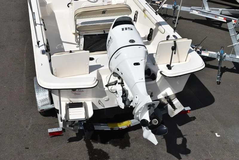 Slide: The Image of 2021 Carolina Skiff 19 LS boat with 115 HP outboard motor, viewed from the rear. - 9