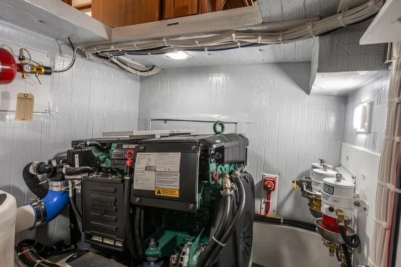 Slide: The Image of Engine room of 2026 American Tug 362 with modern equipment and wiring. - 12