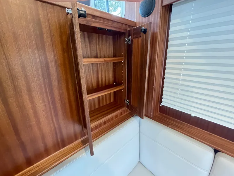 Slide: The Image of Open wooden cabinet in the 2025 American Tug 362 interior. - 22