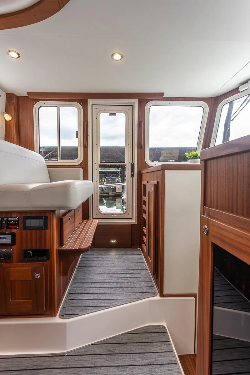 Slide: The Image of Interior of 2026 American Tug 362, featuring wood accents and modern design elements. - 3