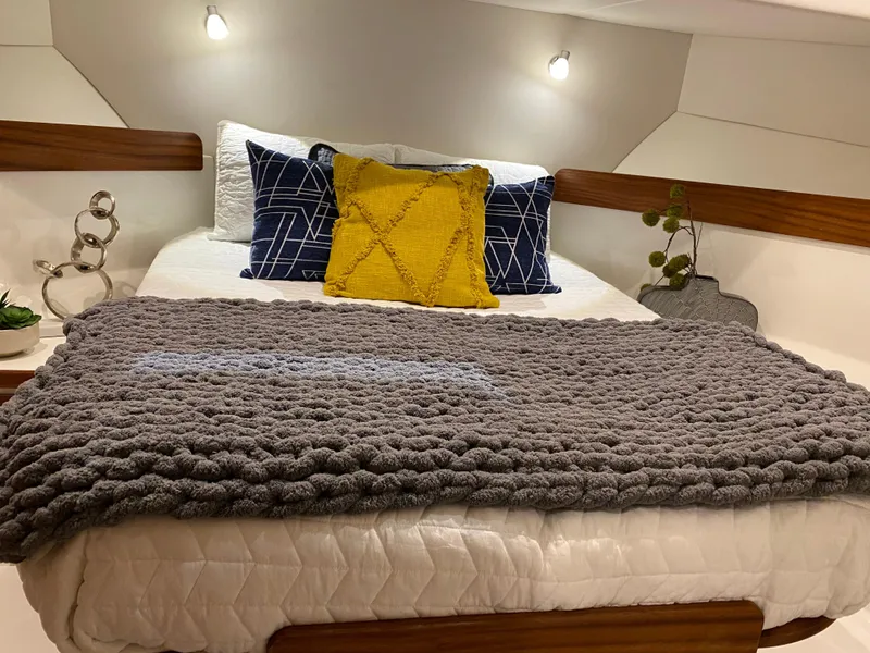 Slide: The Image of Cozy bedroom in 2025 American Tug 362 with modern decor and plush bedding. - 32