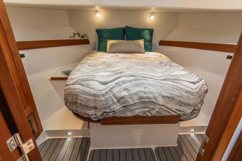 Slide: The Image of Cozy bedroom in 2026 American Tug 362 with modern decor and ambient lighting. - 7