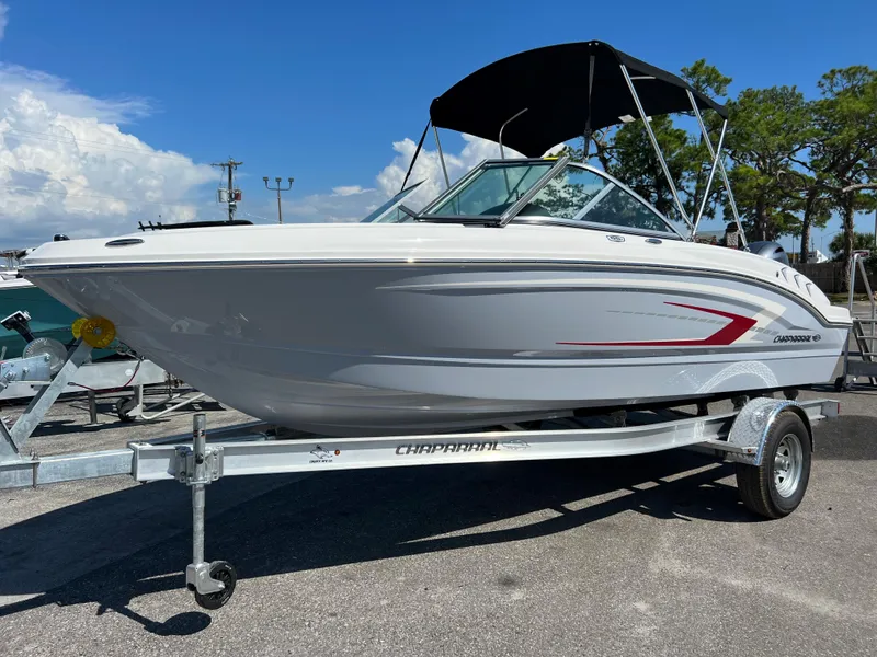 The Image of 2024 Chaparral 19 SSi boat on trailer with black canopy. - 0