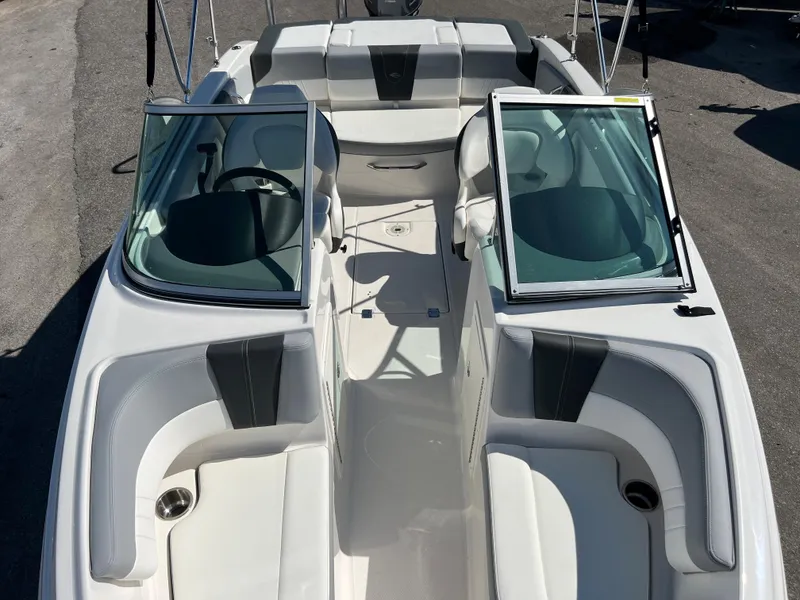 Slide: The Image of 2024 Chaparral 19 SSi boat interior with open windshield and seating. - 10