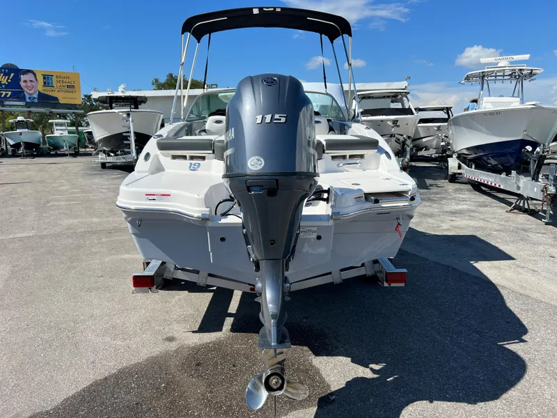 Slide: The Image of 2024 Chaparral 19 SSi boat with Yamaha 115 outboard motor, rear view. - 2