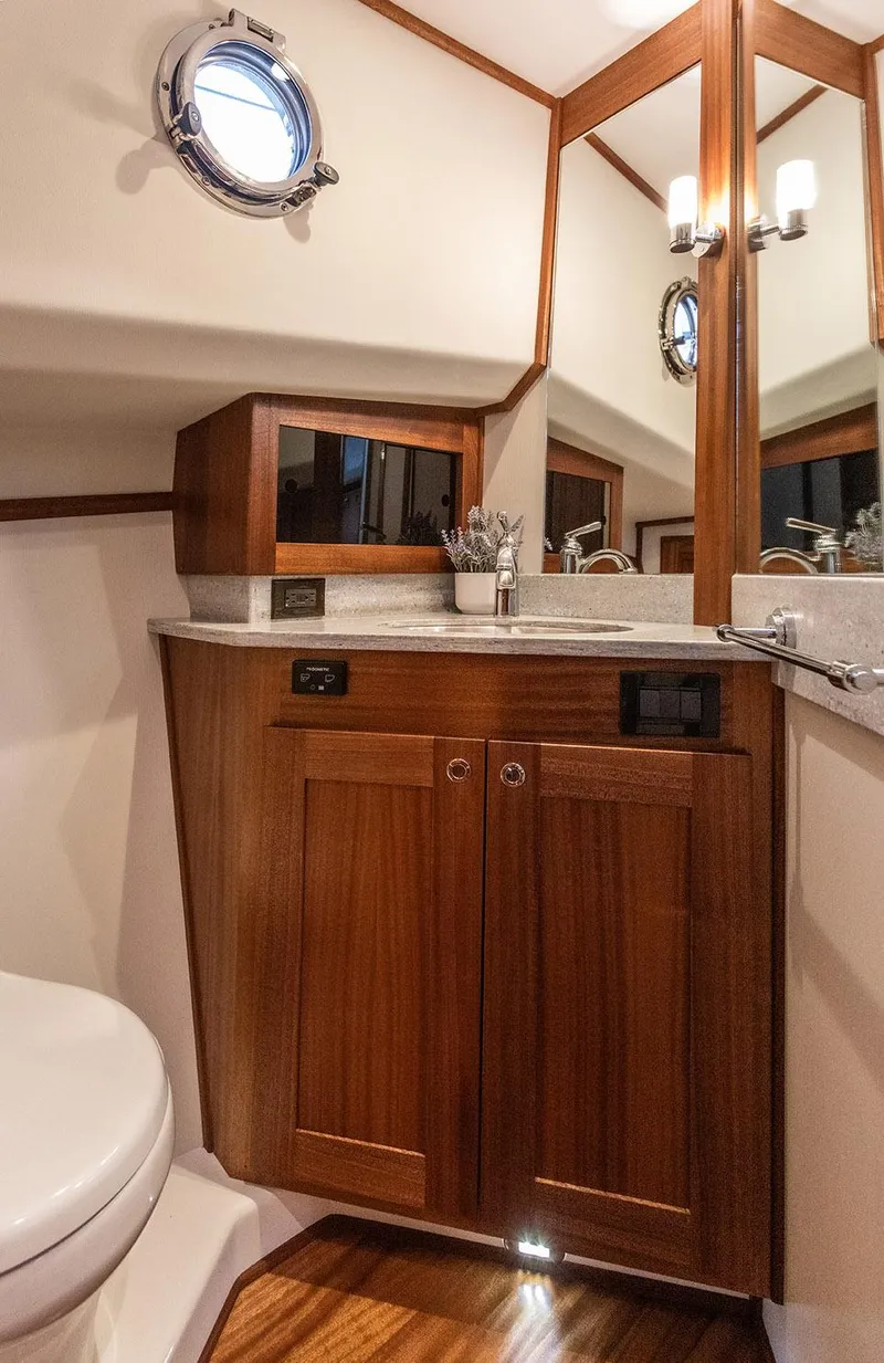 Slide: The Image of Luxurious bathroom in 2026 American Tug 395 with wooden cabinetry and modern fixtures. - 15