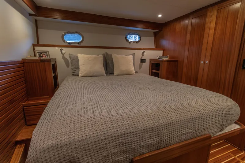 Slide: The Image of Luxurious cabin interior of 2026 American Tug 435 with wooden accents and cozy bedding. - 20