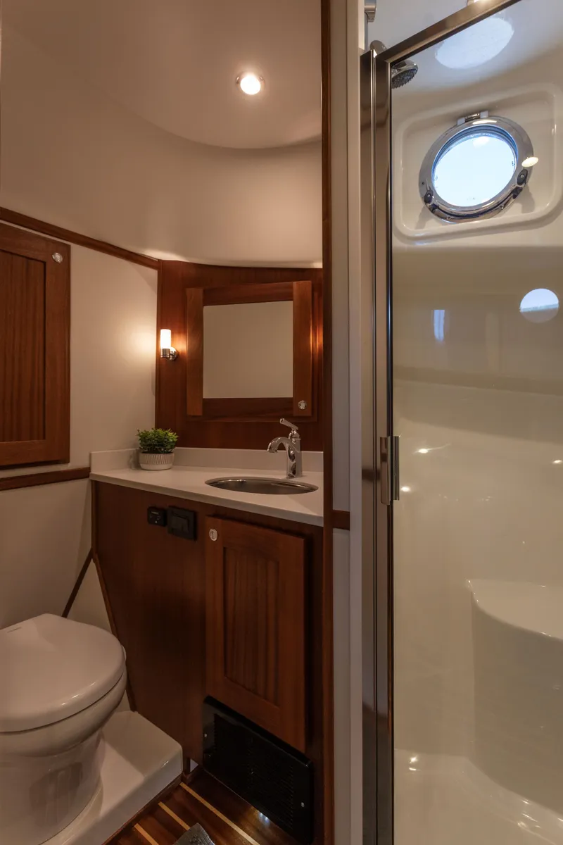 Slide: The Image of Modern bathroom in 2026 American Tug 435 yacht with shower and porthole. - 24