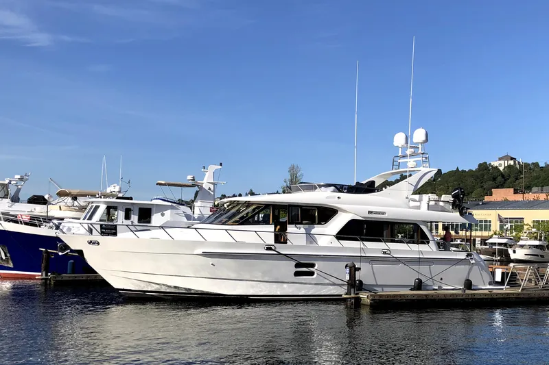 Slide: The Image of 2007 Regency Yachts 670 Pilothouse docked at a marina on a sunny day. - 1