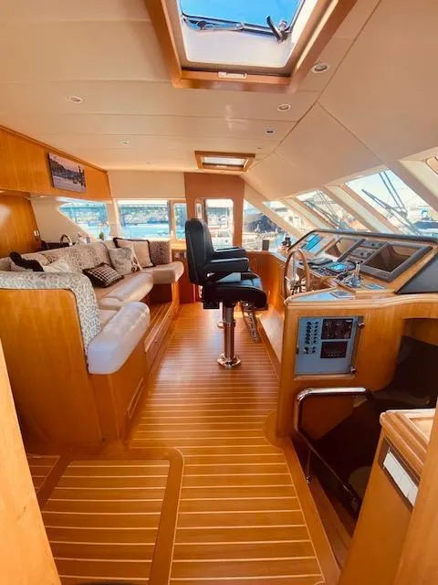 Slide: The Image of Luxurious interior of 2007 Regency Yachts 670 Pilothouse with plush seating and modern helm. - 13