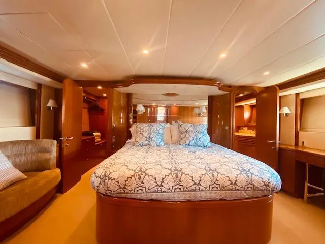 Slide: The Image of Luxurious master bedroom in 2007 Regency Yachts 670 Pilothouse with elegant wood finishes. - 21