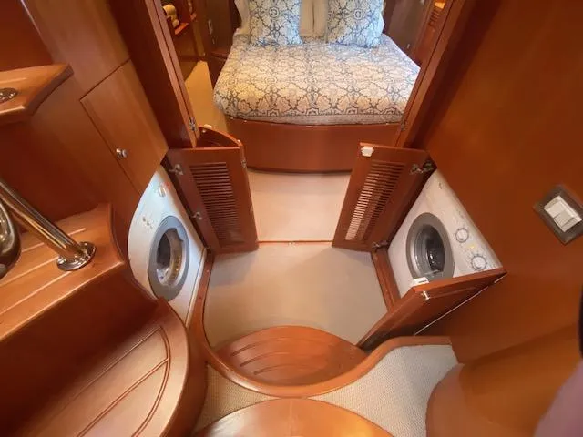 Slide: The Image of 2007 Regency Yachts 670 Pilothouse interior with washer and dryer units. - 22