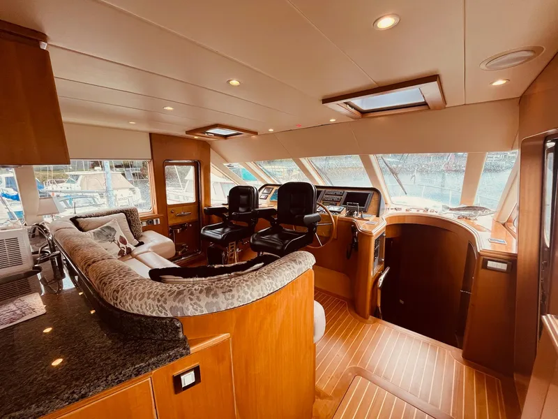Slide: The Image of Luxurious 2007 Regency Yachts 670 Pilothouse interior with elegant seating and modern helm. - 31