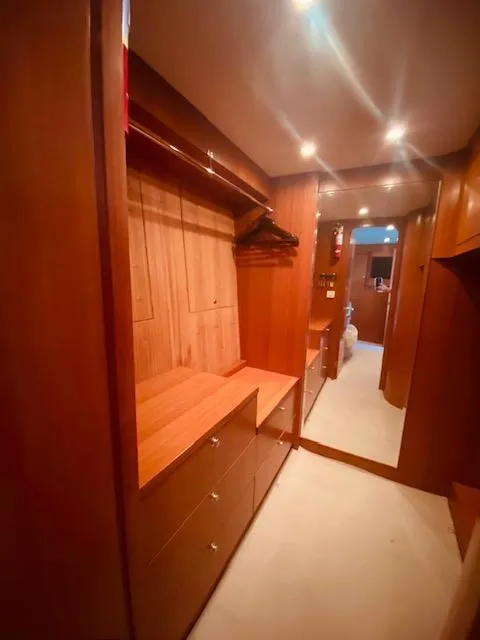 Slide: The Image of 2007 Regency Yachts 670 Pilothouse walk-in closet with wooden cabinetry and ample storage. - 33
