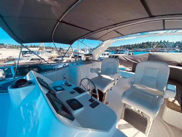 Slide: The Image of 2007 Regency Yachts 670 Pilothouse helm station with dual captain chairs. - 38