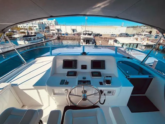 Slide: The Image of 2007 Regency Yachts 670 Pilothouse helm station with marina view - 41