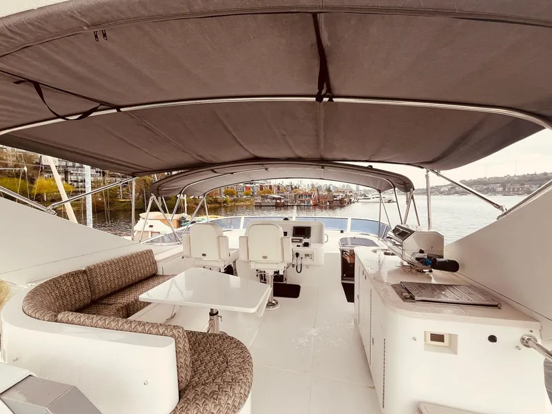 Slide: The Image of 2007 Regency Yachts 670 Pilothouse interior with seating, helm, and covered deck. - 45