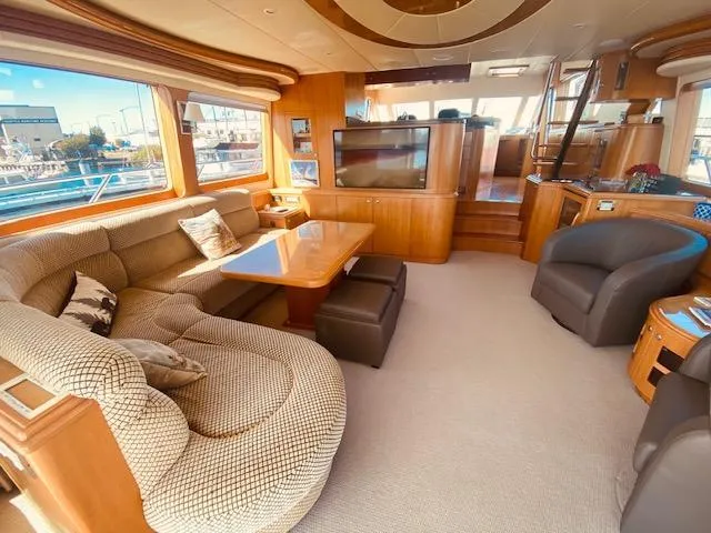 Slide: The Image of Luxurious interior of 2007 Regency Yachts 670 Pilothouse with plush seating and large windows. - 6